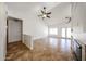 Open-concept living space boasts neutral tones, a fireplace, tile flooring, and lots of natural light at 1833 E Redfield Rd, Phoenix, AZ 85022