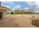 Spacious backyard with low-maintenance gravel landscaping and a covered patio area at 1838 E Crocus Dr, Phoenix, AZ 85022