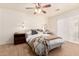 Bright bedroom featuring natural light, wood-look tile flooring, and neutral decor throughout at 1838 E Crocus Dr, Phoenix, AZ 85022