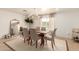 Bright dining room featuring a dining table set for six, chandelier, and large mirror at 1838 E Crocus Dr, Phoenix, AZ 85022