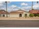 Attractive single-story home featuring a tile roof, arched entry, and xeriscaped front yard at 1838 E Crocus Dr, Phoenix, AZ 85022