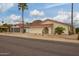Charming single-story home with a tile roof, desert landscaping, and a two-car garage at 1838 E Crocus Dr, Phoenix, AZ 85022