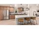 Bright kitchen boasts stainless steel appliances, pendant lighting, and a large center island with barstool seating at 1838 E Crocus Dr, Phoenix, AZ 85022