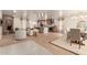 Open concept living area with a fireplace, wood-look floors, dining room and kitchen view at 1838 E Crocus Dr, Phoenix, AZ 85022