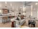 Open concept living space featuring bar seating at the kitchen island, and dining area beyond the comfortable sofa at 1838 E Crocus Dr, Phoenix, AZ 85022