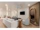 Comfortable living room with a brick fireplace, neutral tones, wood-look floors, and plenty of natural light at 1838 E Crocus Dr, Phoenix, AZ 85022