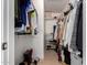 Spacious walk-in closet featuring built-in shelving to maximize storage in the primary suite at 1838 E Crocus Dr, Phoenix, AZ 85022