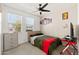 A clean, well-lit secondary bedroom features two windows, neutral walls, and soft carpeting at 19181 W Jackson St, Buckeye, AZ 85326