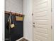 Entryway with hooks for storage and a light-colored front door at 19181 W Jackson St, Buckeye, AZ 85326