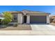 Charming single-story home featuring a tile roof and a spacious two-car garage at 19181 W Jackson St, Buckeye, AZ 85326