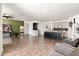 Bright open-concept living area and kitchen with modern finishes and tile flooring, great for entertaining at 19181 W Jackson St, Buckeye, AZ 85326