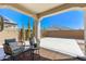 Covered patio with outdoor seating and a view of the backyard at 19181 W Jackson St, Buckeye, AZ 85326