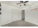 Bedroom with carpet, a ceiling fan, and a window offering great light at 1926 W Busoni Pl, Phoenix, AZ 85023
