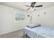 Bright bedroom has large window offering pleasant view and natural light at 1926 W Busoni Pl, Phoenix, AZ 85023