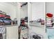 Walk-in closet with custom shelving and ample storage for clothes and accessories at 1926 W Busoni Pl, Phoenix, AZ 85023