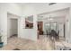 Open-concept dining area with tile floors adjacent to the kitchen and a view to the yard at 1926 W Busoni Pl, Phoenix, AZ 85023