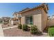 Charming single-Gathering home featuring desert landscaping, a tile roof, and a covered entry at 1926 W Busoni Pl, Phoenix, AZ 85023
