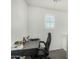 This office space offers a well-lit spot for work, complete with a window and a desk setup at 1926 W Busoni Pl, Phoenix, AZ 85023