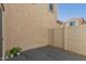 Private patio with potted plants and beige stucco wall and fence at 1926 W Busoni Pl, Phoenix, AZ 85023