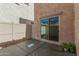 A private patio with stucco walls and sliding door, perfect for relaxing outdoors at 1926 W Busoni Pl, Phoenix, AZ 85023