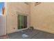 A private patio with stucco wall and a sliding door for indoor-outdoor living at 1926 W Busoni Pl, Phoenix, AZ 85023
