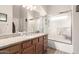 Bright bathroom with granite counters and shower at 22499 N Dietz Dr, Maricopa, AZ 85138