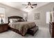 Comfortable bedroom showcasing a spacious bed and ceiling fan at 22499 N Dietz Dr, Maricopa, AZ 85138
