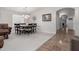Bright dining area features carpet flooring, neutral paint, and chandelier lighting at 22499 N Dietz Dr, Maricopa, AZ 85138