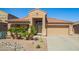 Charming single-story home with desert landscaping, tile roof, and two-car garage at 22499 N Dietz Dr, Maricopa, AZ 85138
