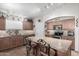 Updated kitchen featuring granite counters, modern appliances, and seating at the kitchen island at 22499 N Dietz Dr, Maricopa, AZ 85138
