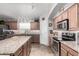 Charming kitchen with granite countertops, stainless steel appliances, and ample cabinet space at 22499 N Dietz Dr, Maricopa, AZ 85138