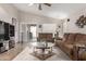 Relaxing living room offering natural light, patio access, and stylish decor for a cozy atmosphere at 22499 N Dietz Dr, Maricopa, AZ 85138