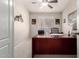 Functional home office space with a large desk and a comfortable chair in a private area at 22499 N Dietz Dr, Maricopa, AZ 85138
