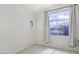 Cozy bedroom with a circular window and large window dressed with curtains at 228 W Bolero Dr, Tempe, AZ 85284