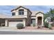 Charming two-story home featuring a tile roof, low-maintenance landscaping, and a two car garage at 228 W Bolero Dr, Tempe, AZ 85284