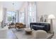 Bright living room with large windows, modern furniture, and decorative accents at 228 W Bolero Dr, Tempe, AZ 85284