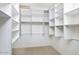 Spacious walk-in closet with custom shelving and ample storage solutions at 228 W Bolero Dr, Tempe, AZ 85284