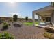 Backyard featuring desert landscaping, a covered patio, and views of the surrounding landscape at 26955 W Adam Ave, Buckeye, AZ 85396