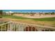 Beautiful golf course view from the balcony, complete with lush greenery and desert landscaping at 2741 N 137Th Ave, Goodyear, AZ 85395