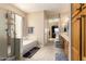 Bright bathroom featuring a soaking tub, separate shower, and double sink vanity at 2741 N 137Th Ave, Goodyear, AZ 85395