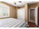 Bedroom featuring a ceiling fan, hardwood floors, a closet, and a shuttered window at 2741 N 137Th Ave, Goodyear, AZ 85395