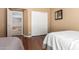 This bedroom showcases a closet with sliding doors and a view of the staircase and living area at 2741 N 137Th Ave, Goodyear, AZ 85395