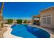 Sparkling pool and spa with lush landscaping, offering a private and serene outdoor experience at 2741 N 137Th Ave, Goodyear, AZ 85395