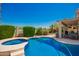 Inviting pool and spa area surrounded by lush greenery, creating a private and relaxing outdoor space at 2741 N 137Th Ave, Goodyear, AZ 85395