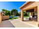 Beautiful backyard featuring a pool, patio, manicured lawn, and sitting area at 3535 E Crescent Way, Gilbert, AZ 85298