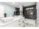 Modern bathroom with double vanity, black fixtures, and sleek marble shower at 3535 E Crescent Way, Gilbert, AZ 85298