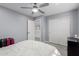 Cozy bedroom featuring a ceiling fan, closet, and comfortable bed at 3535 E Crescent Way, Gilbert, AZ 85298