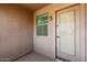 Cozy covered front porch with a secure door, providing a welcoming entrance to the residence at 3535 E Crescent Way, Gilbert, AZ 85298