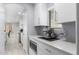 Bright, contemporary kitchen with stainless steel appliances and sleek white cabinets at 3535 E Crescent Way, Gilbert, AZ 85298