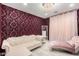 Stylish sitting room with a purple accent wall, chandelier, and chaise lounge at 3535 E Crescent Way, Gilbert, AZ 85298